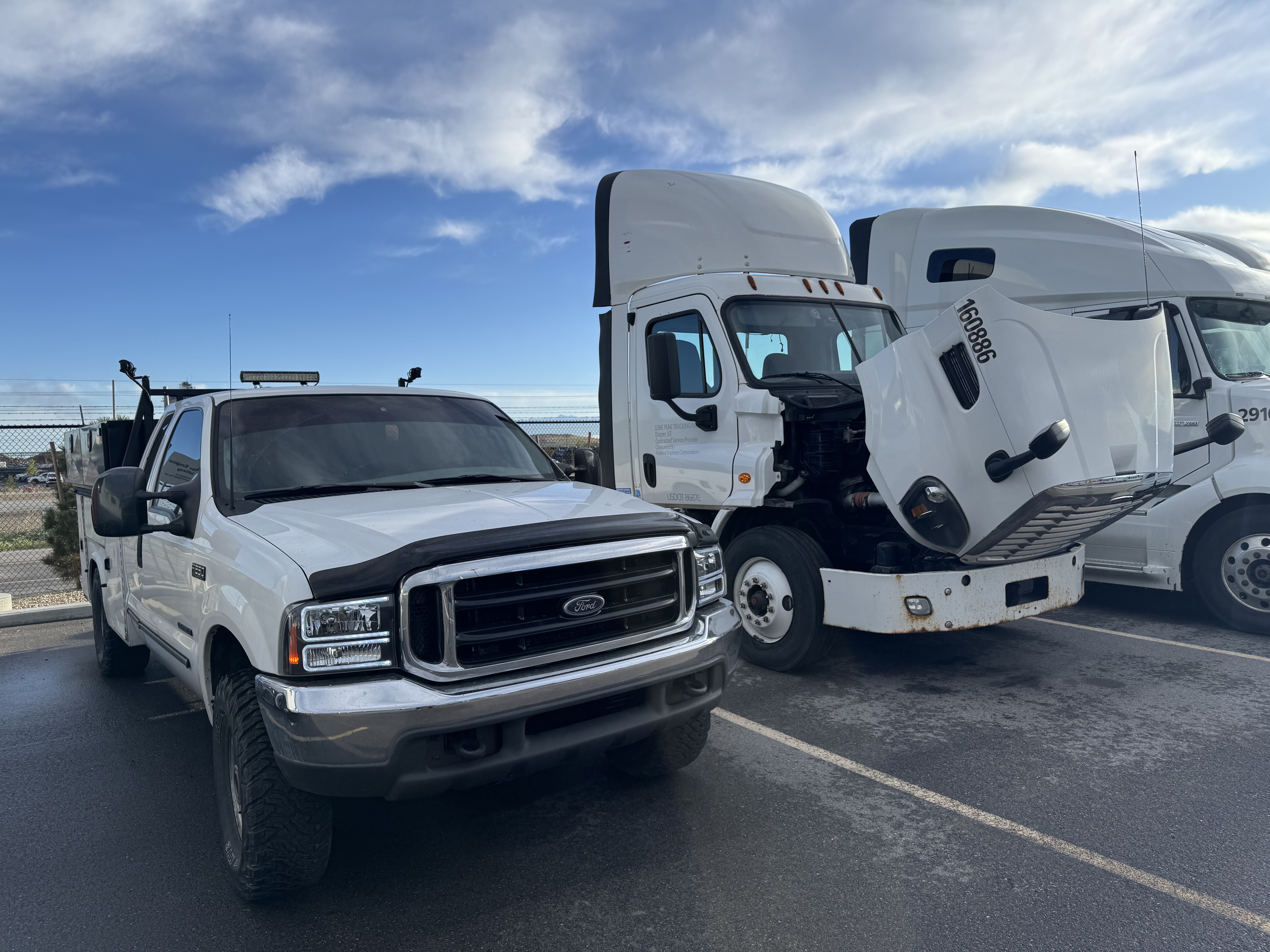 Technician performing on-site fleet maintenance